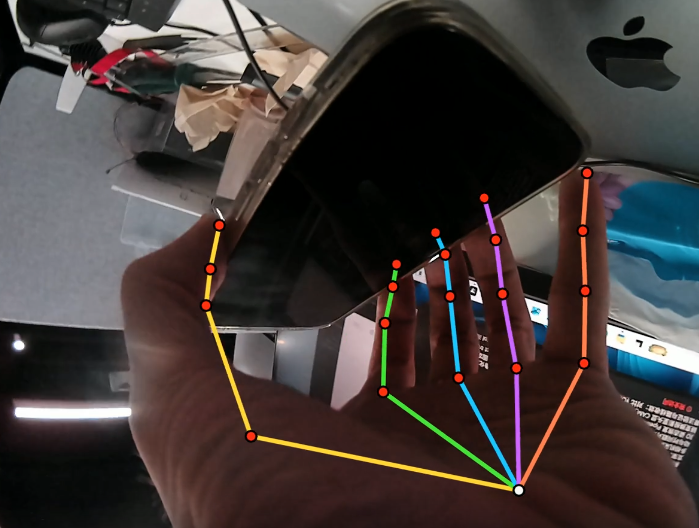 Hand skeleton detected from an inward-facing wrist camera while manipulating a tablet