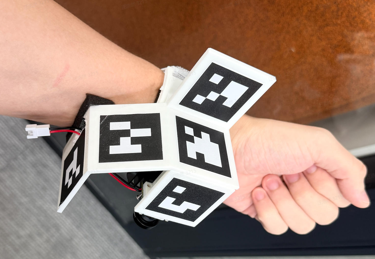 Wearable wristband prototype with multiple fiducial markers and an inward-facing camera